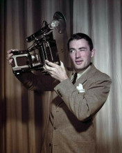 Gregory Peck holds up vintage camera early 1950's era wearing suit 8x10 photo