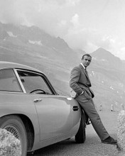 Sean Connery iconic on mountain road leans against Aston Martin Goldfinger 8x10