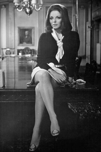 Joan Collins shows legs sits on desk 8x10 photo 1970 The Executioner