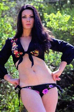 Edwige Fenech hands on hips wearing black bikini 8x12 inch photo