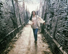 Labyrinth 1986 Jennifer Connelly walks between two walls 8x10 inch photo
