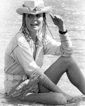 Bo derek sits in surf wearing beach hat 1979 movie 10 8x10 inch photo