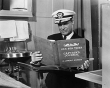 Cary Grant in uniform looks at Captains log Operation Petticoat 8x10 inch photo