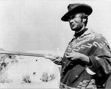 Clint Eastwood holds pocketwatch and rifle For A Few Dollars More 8x10 photo
