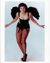 Lucy Lawless 8x10 inch photo wearing corset and stockings smiling glamour pose