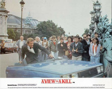 A View To A Kill Roger Moore at wheel of Renault 11 split in half 8x10 photo