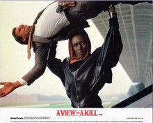 A View To A Kill Grace Jones picks up man above her head 8x10 inch photo