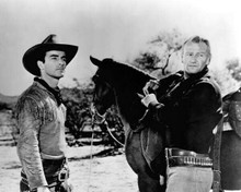 Red River 1948 John Wayne saddles horse with Montgomery Clift 8x10 inch photo