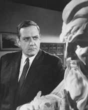 Raymond Burr in dark suit as Perry mason by statue 8x10 inch photo