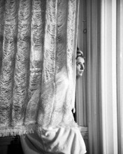 Audrey Hepburn in towelling robe sits in window Breakfast at Tiffany's 8x10
