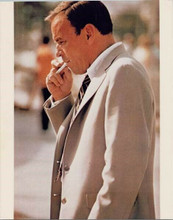 Frank Sinatra in raincoat smoking cigarette between takes Naked Runner 8x10