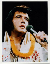 Elvis Presley with Hawaiian ley around his neck on stage singing 8x10 inch photo