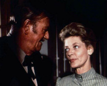 The Shootist John Wayne looks at Lauren Bacall 8x10 inch photo