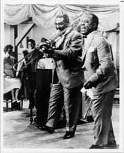 Louis Armstrong performing with his band 8x10 inch photo