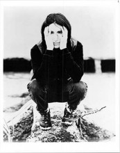 Trent Reznor 8x10 inch photo crouches down posing on log