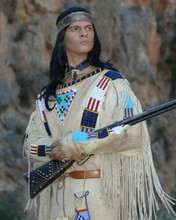 Pierrce Brice as Mescalero Apache chief Winnetou holding rifle 8x10 inch photo