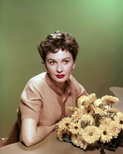 Jean Simmons beautiful 1950's portrait posing next to flowers 8x10 inch photo