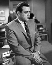 Raymond Burr as Perry Mason sitting on his desk smoking cigarette 8x10 photo