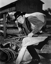 James Drury as Shiloh's The Virginian getting out his bedroll 8x10 inch photo