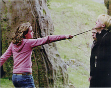 Emma Watson points magic stick toward Tom Felton in scene from Harry Potter