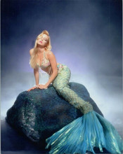 Traci Lords in mermaid outfit sitting on rock 8x10 photo