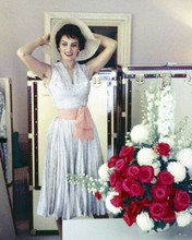 Sophia Loren 1950's era in white dress smiling trying on hat 8x10 inch photo
