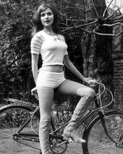 Madeline Smith huge bust bare midriff white hot pants & boots 8x10 inch photo