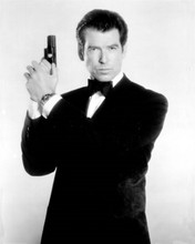 Pierce Brosnan in classic Bond pose gun raised wearing tuxedo 8x10 inch photo