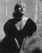 Carole Lombard striking pose in black dress with plunging neckline 8x10 photo