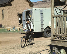 Paul Newman rides bicycle between takes on Butch Cassidy set 8x10 inch photo