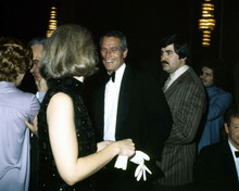 Paul Newman in tuxedo flashes a smile at woman 1970's Hollywood event 8x10 photo