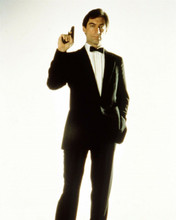 Timothy Dalton suave in tuxedo holds up gun as Bond Living Daylights 8x10 photo
