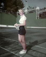 Ginger Rogers in tennis shorts holding raquet by net 1940's era 8x10 inch photo