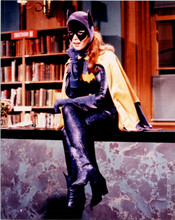 Yvonne Craig TV's Batgirl sitting on edge of desk in library 8x10 inch photo