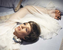 Julie Andrews lies back on bed in white nightdress 8x10 inch photo