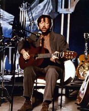 Eric Clapton 1992 seated in chair playing guitar Unplugged 8x10 inch photo