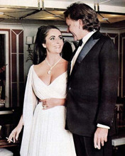 Richard Burton smiles at Elizabeth Taylor in low cut white gown 8x10 photo