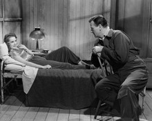 Jet Pilot 1957 John Wayne looks at Janet Leigh on bed 8x10 inch photo