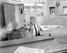 John Wayne The Duke takes aim & fires gun from 1975 Brannigan 8x10 photo