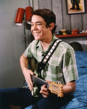 The Brady Bunch Christopher Knight on bed playing guitar as Peter 8x10 photo
