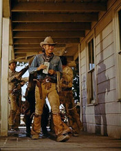 Steve McQueen with gunbelt walking in town nevada Smith 8x10 inch photo