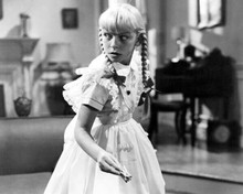 Patty McCormack holding matches in 1956 cult The Bad Seed 8x10 inch photo