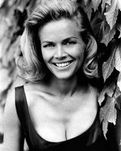 Honor Blackman smiles revealing a huge cleavage 1960's era 8x10 inch photo