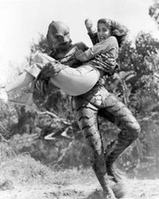 Revenge of the Creature The Gill Man runs off with Lori Nelson 8x10 inch photo