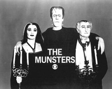 The Munsters with CBS logo De Carlo Gwynne & Lewis hold candles 8x10 inch photo