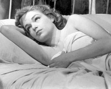 Simone Signoret lies in bed with sheet wrapped over chest 8x10 inch photo
