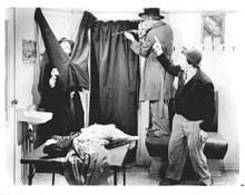 The Marx Brothers Groucho hides behind pants Harpo & Chico 8x10 inch photo