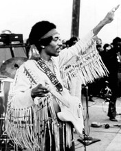 Jimi Hendrix on stage 1969 at Woodstock points in the air 8x10 inch photo