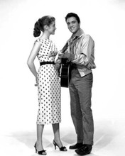 Elvis Presley smiling strumming his guitar with unidentified actress 8x10 photo