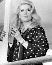 Catherine Deneuve in polka dot dress holding drink 1975 Hustle 8x10 inch photo